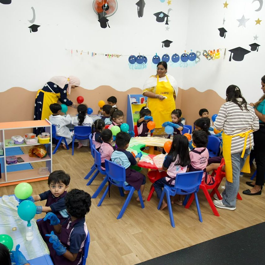 A decorated nursery room set up for a Coding School session.